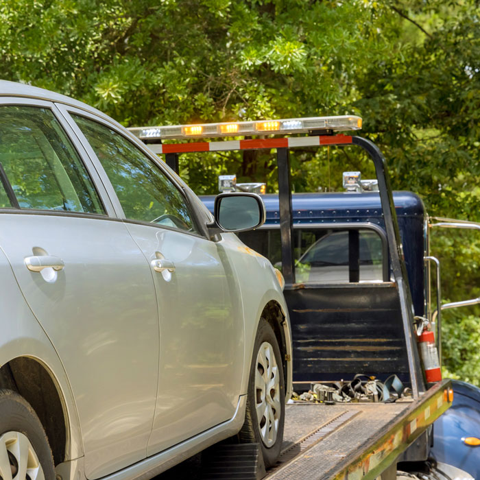 car on the back of a tow truck