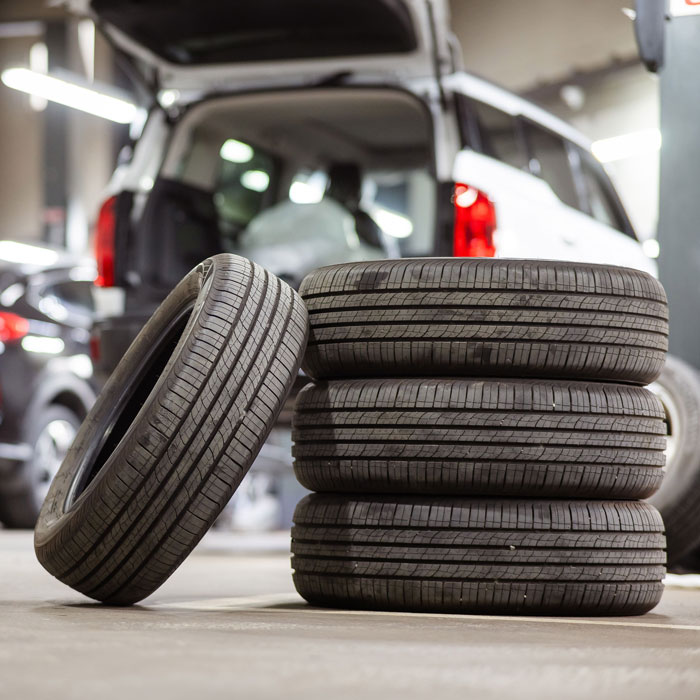 stack of tires on shop floor